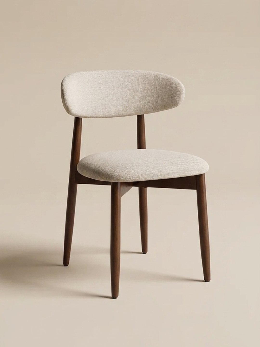 A single COLAMY dining chair with a light beige upholstered seat and backrest, and dark brown wooden legs, set against a plain beige background.